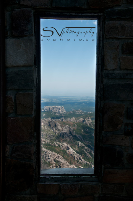 The view through a window of the abandoned fire lookout tower situated on the summit of Harney Peak.