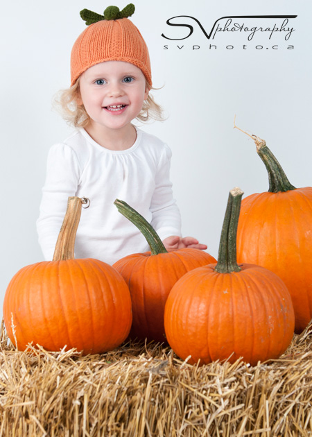 child-with-pumpkins
