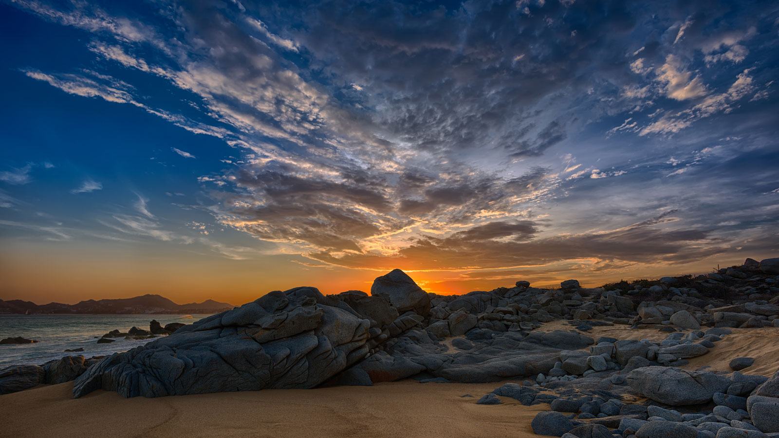 rocks on the beach at sunrise in cabo